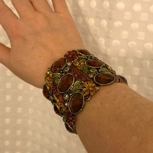 Beaded metal bracelet.  Opens on a spring hinge.